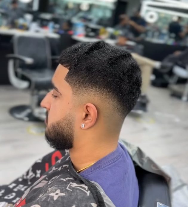 Skin fade with beard line-up
