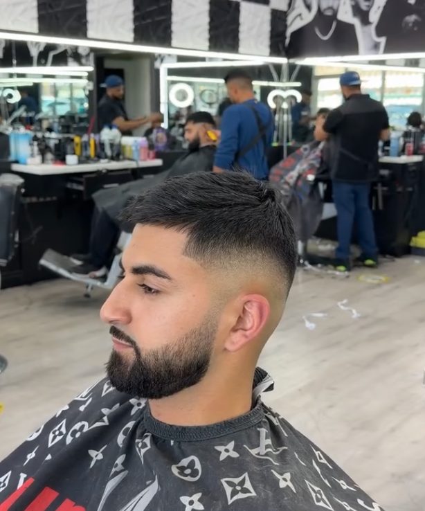 Skin fade and beard, side view