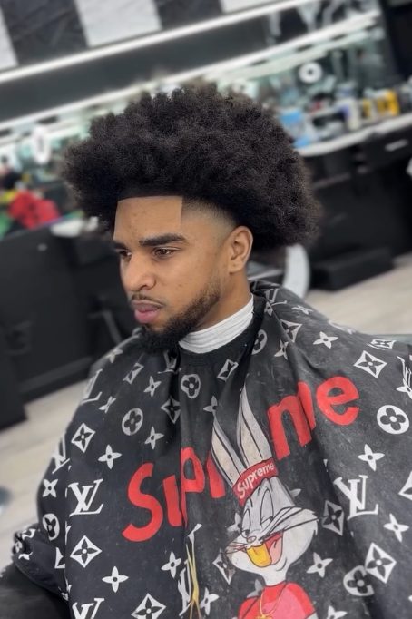 Tall curly afro with fade